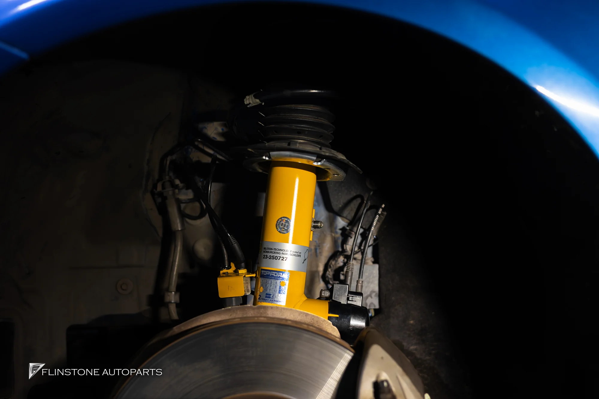 Shock Absorbers BILSTEIN yellow installation at the moment in Wheel Arch car
