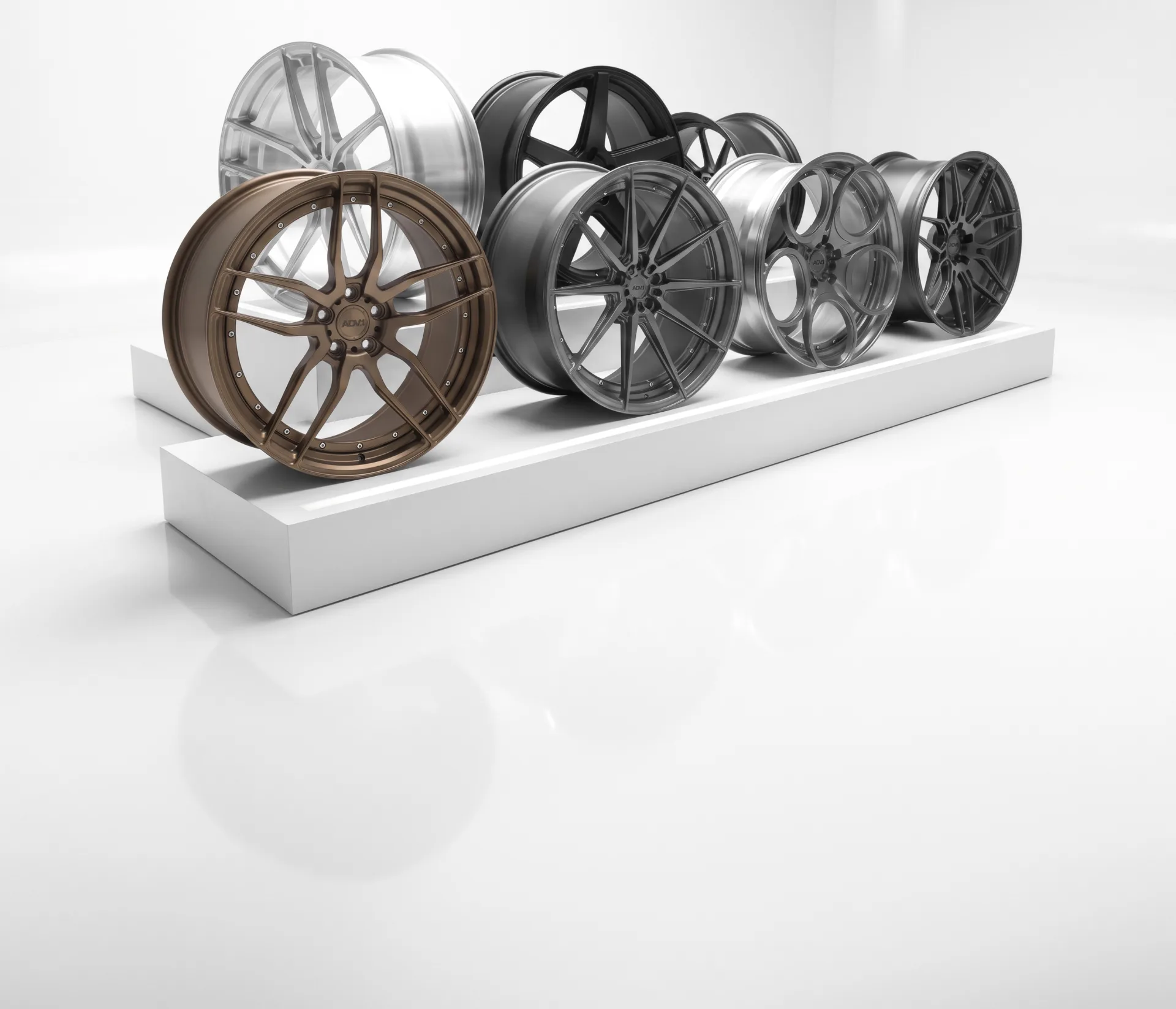 ADV.1 wheels in a variety of designs and colours on a display stand