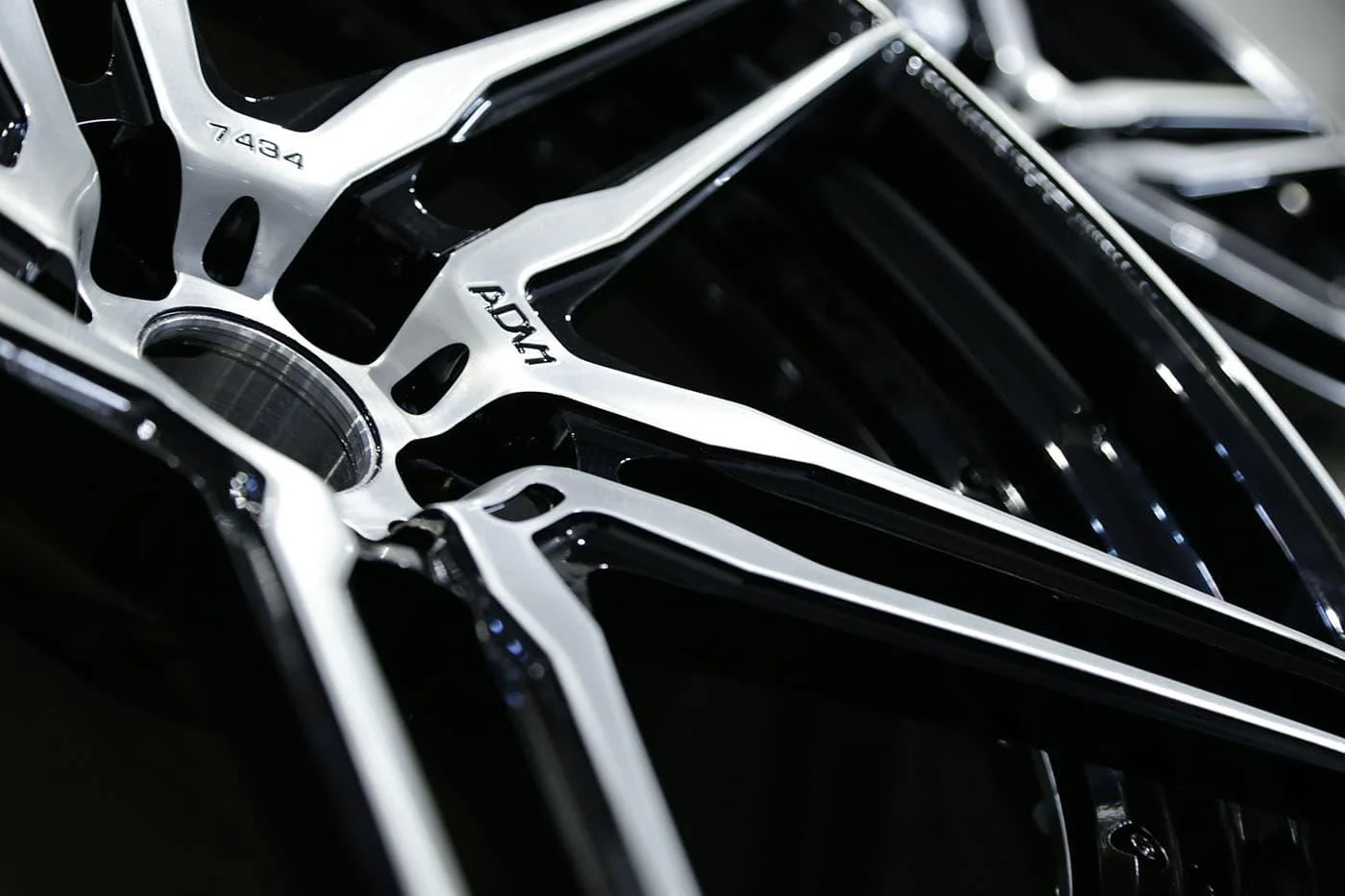 Close-up of ADV.1 wheel spokes in machined silver and gloss black