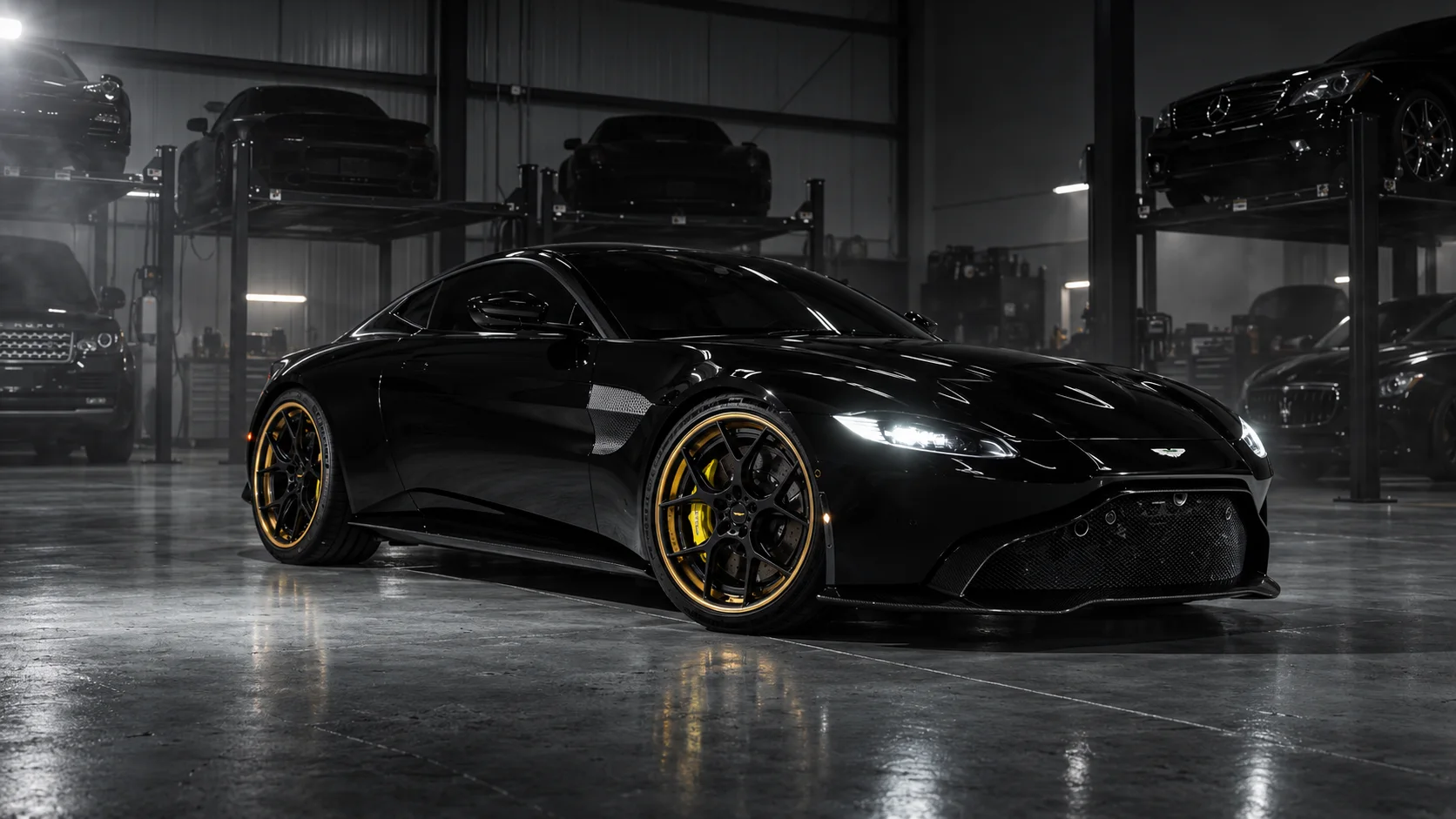 Aston Martin Vantage on gold ADV.1 wheels in a garage