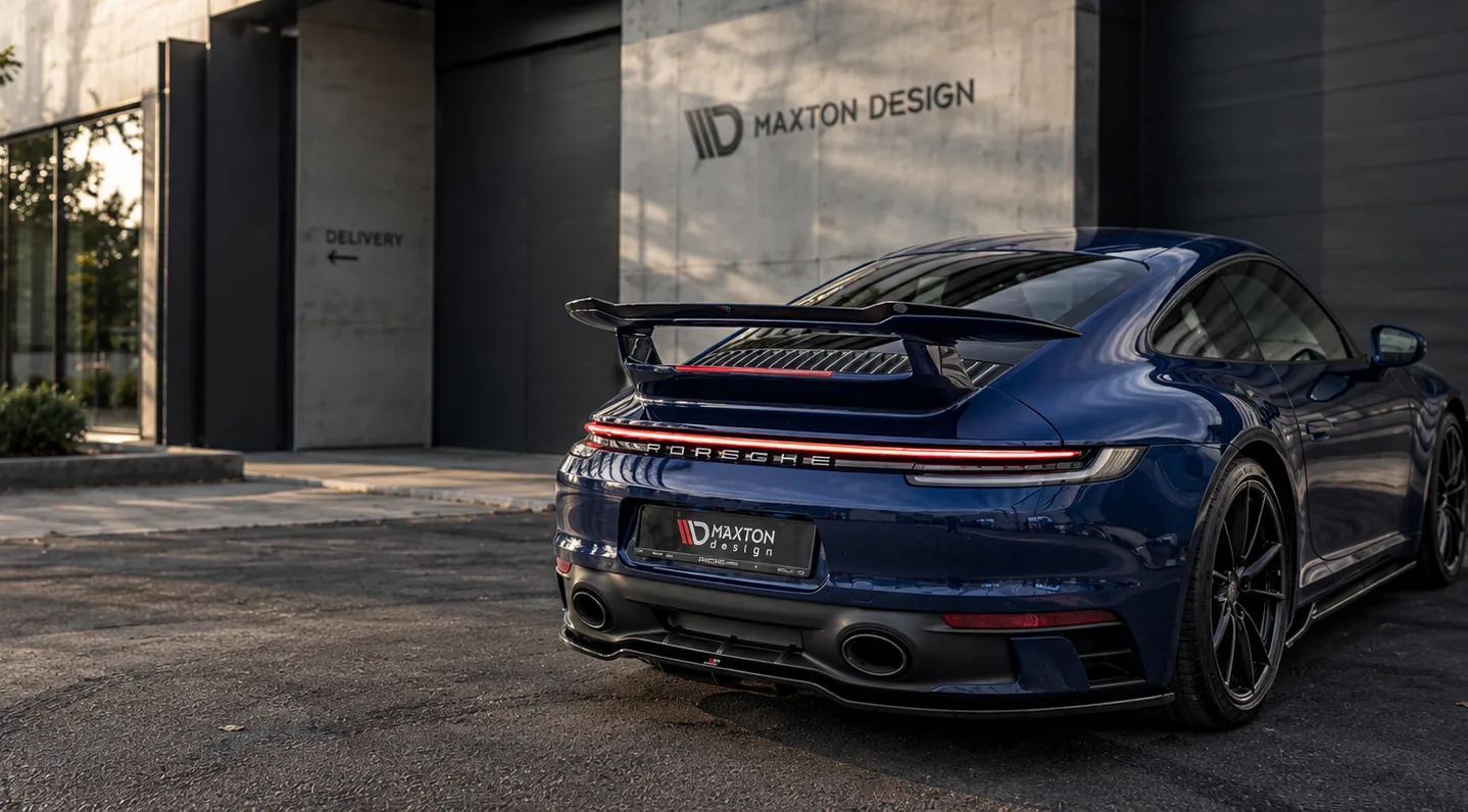 Porsche 911 fitted with a Maxton Design body kit in front of the Maxton Design building
