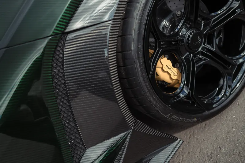 Lamborghini Revuelto with TOPCAR DESIGN R’Evo body kit — Carbon wheel arch and gold brakes