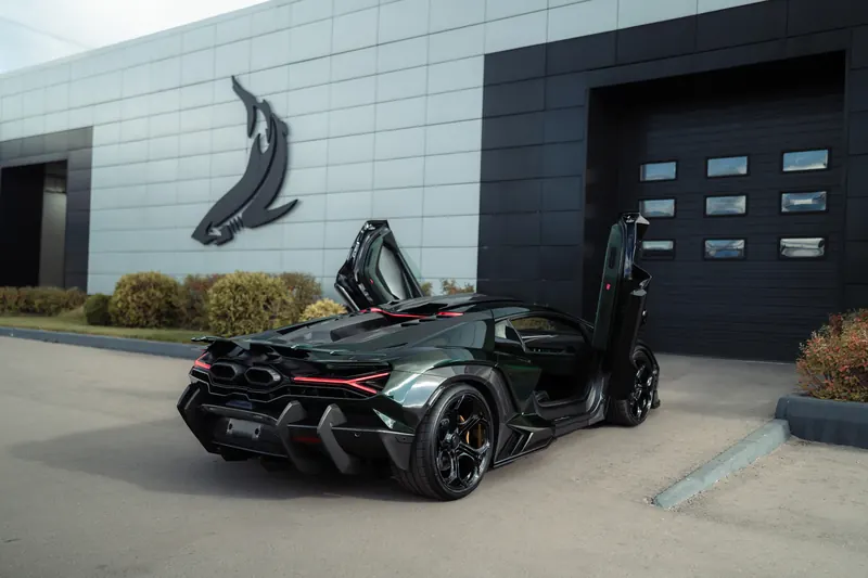 Lamborghini Revuelto with TOPCAR DESIGN R’Evo body kit — Rear three-quarter view, doors open