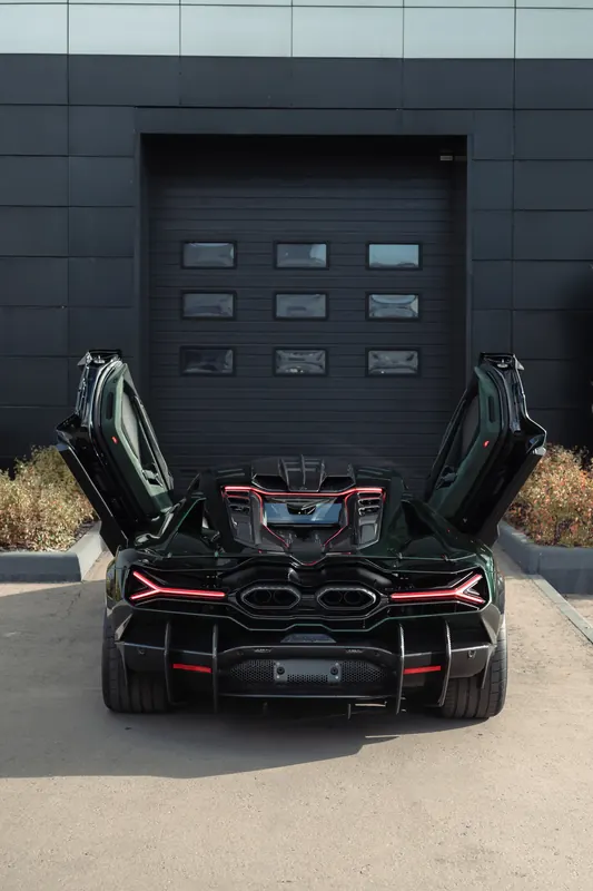 Lamborghini Revuelto with TOPCAR DESIGN R’Evo body kit — Rear view with scissor doors open