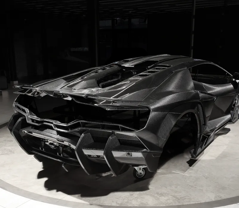 Rear of a Lamborghini Revuelto with carbon diffuser and spoiler, TOPCAR R’Evo Carbon Edition