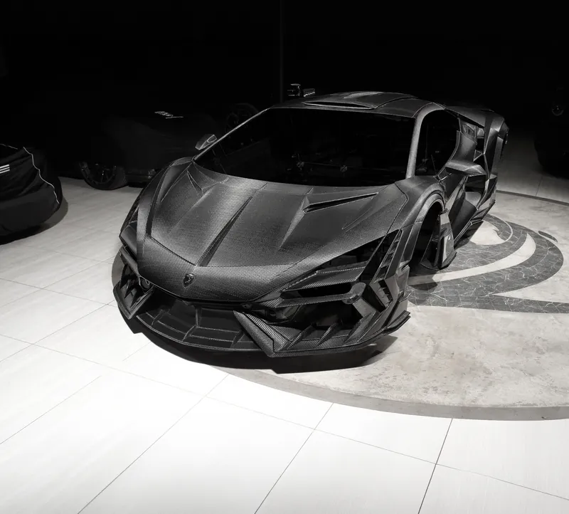 Front three-quarter view of a Lamborghini Revuelto with TOPCAR R’Evo Carbon Edition carbon kit