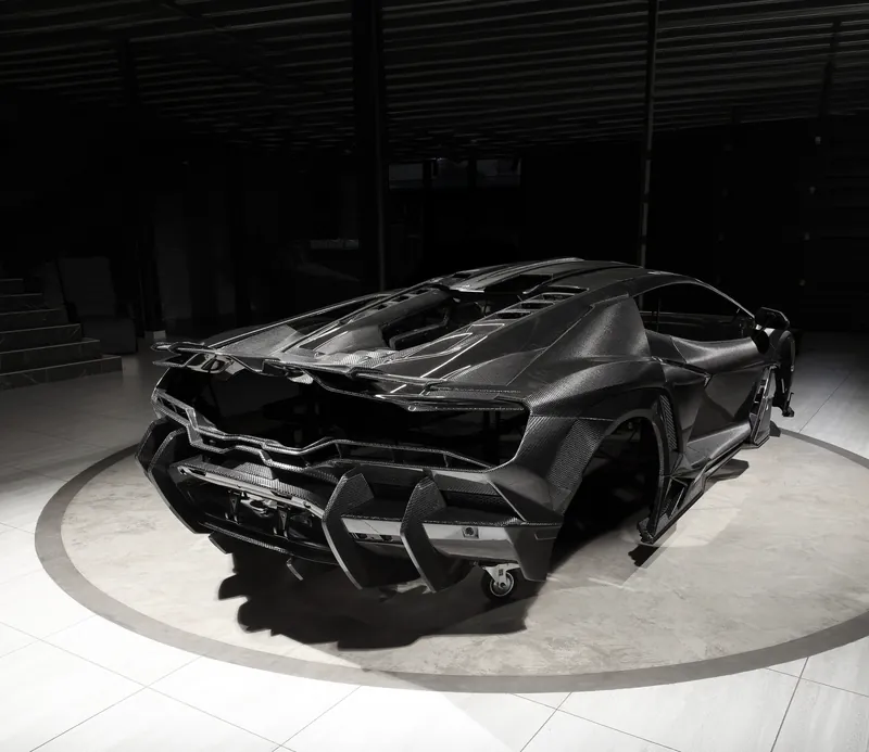 Rear of a Lamborghini Revuelto with diffuser and spoiler, TOPCAR R’Evo Carbon Edition