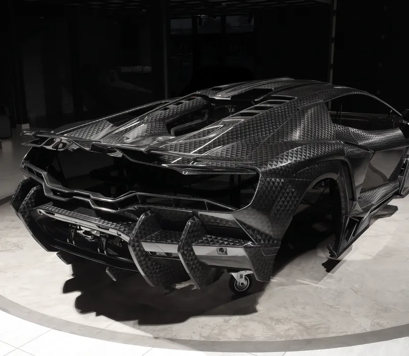 Rear of a Lamborghini Revuelto with carbon diffuser and spoiler, TOPCAR R’Evo Stealth Edition