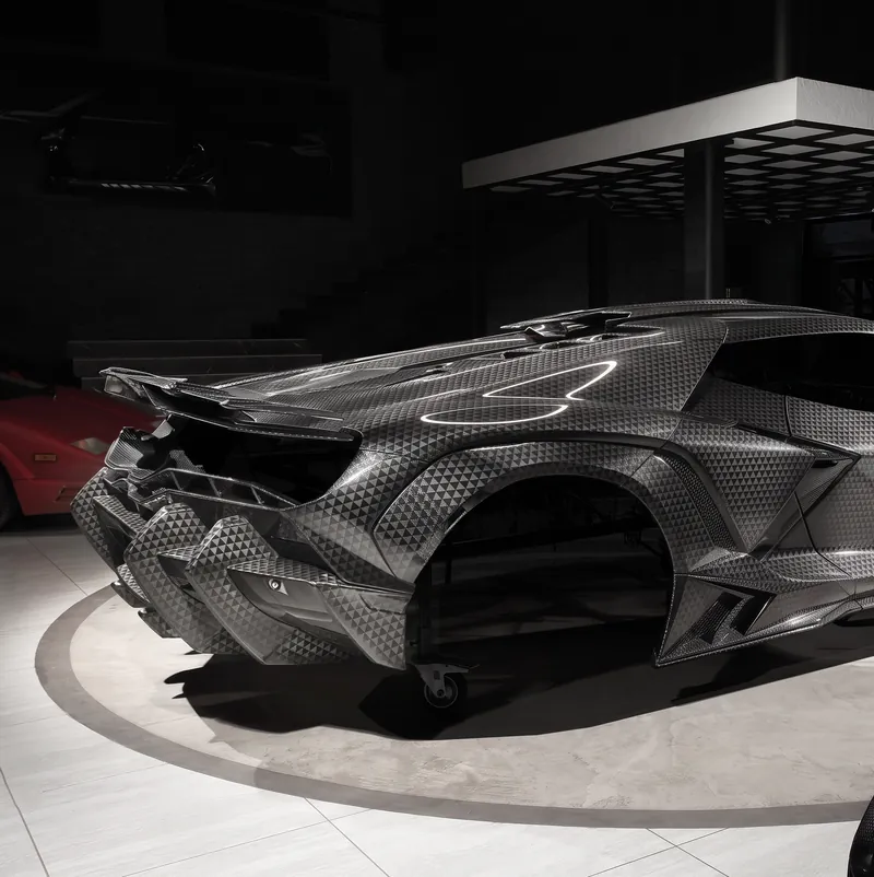 Rear three-quarter view of a Lamborghini Revuelto with TOPCAR R’Evo Stealth Edition body kit